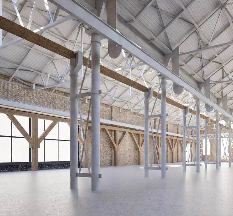 A spacious industrial warehouse with high ceilings, large windows, and exposed wooden and metal framework, ideal for storage or manufacturing purposes.