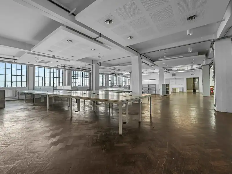 Spacious and bright office interior in Islington with large windows, open layout, and contemporary design, ideal for business and coworking spaces.