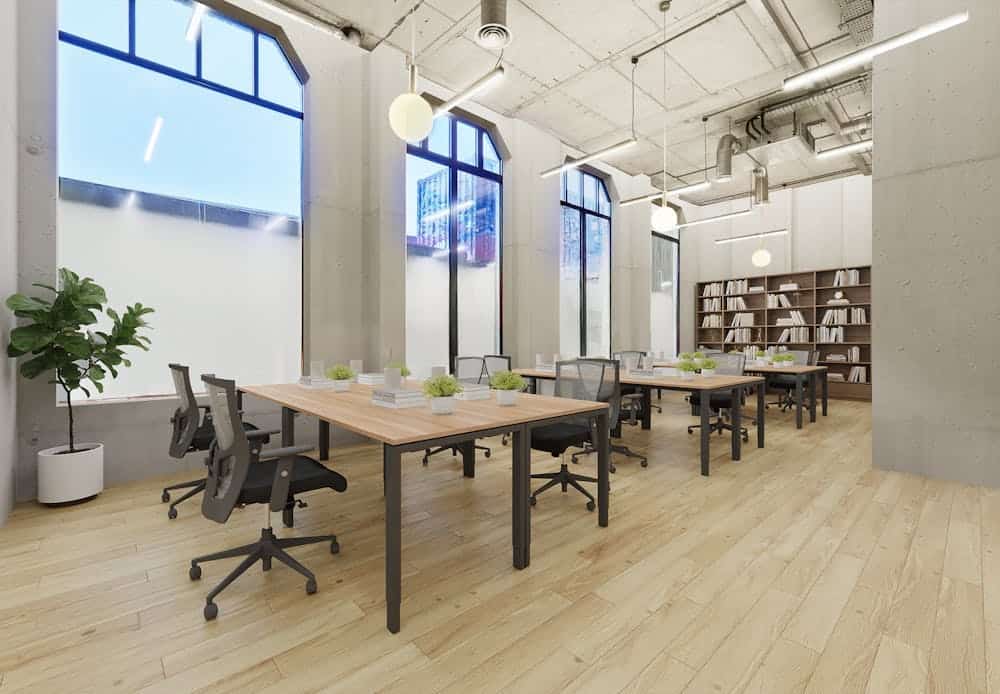 Bright and spacious office with contemporary furniture, large windows providing natural light, and a minimalist design ideal for productive work environments.