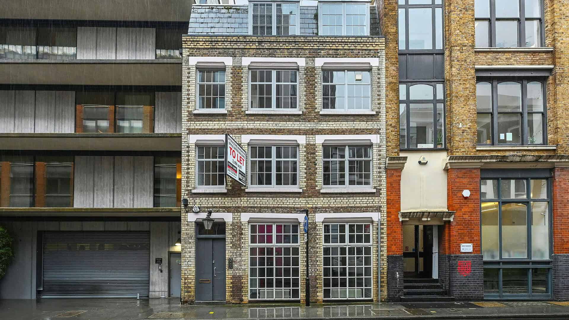 Contemporary multi-story commercial building on Willow Street, London, with large windows and brick facade, in an urban setting.