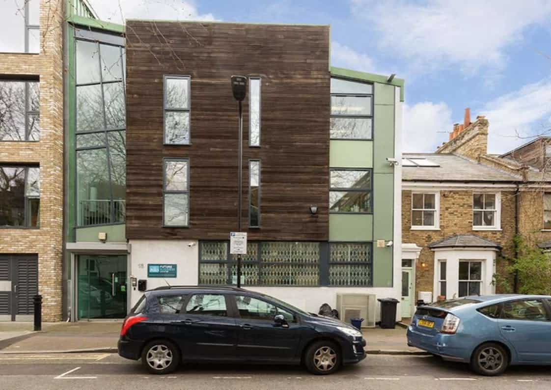Contemporary residential building at 18-20 London Lane E8 3PR with mixed materials and large windows, located in London.