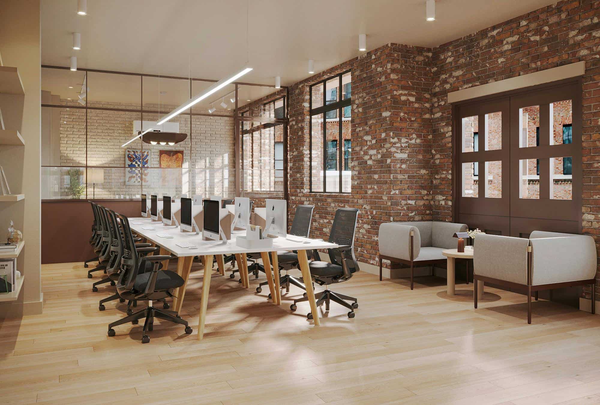 Modern coworking space with brick walls, large windows, and ergonomic office chairs for productive working environments.