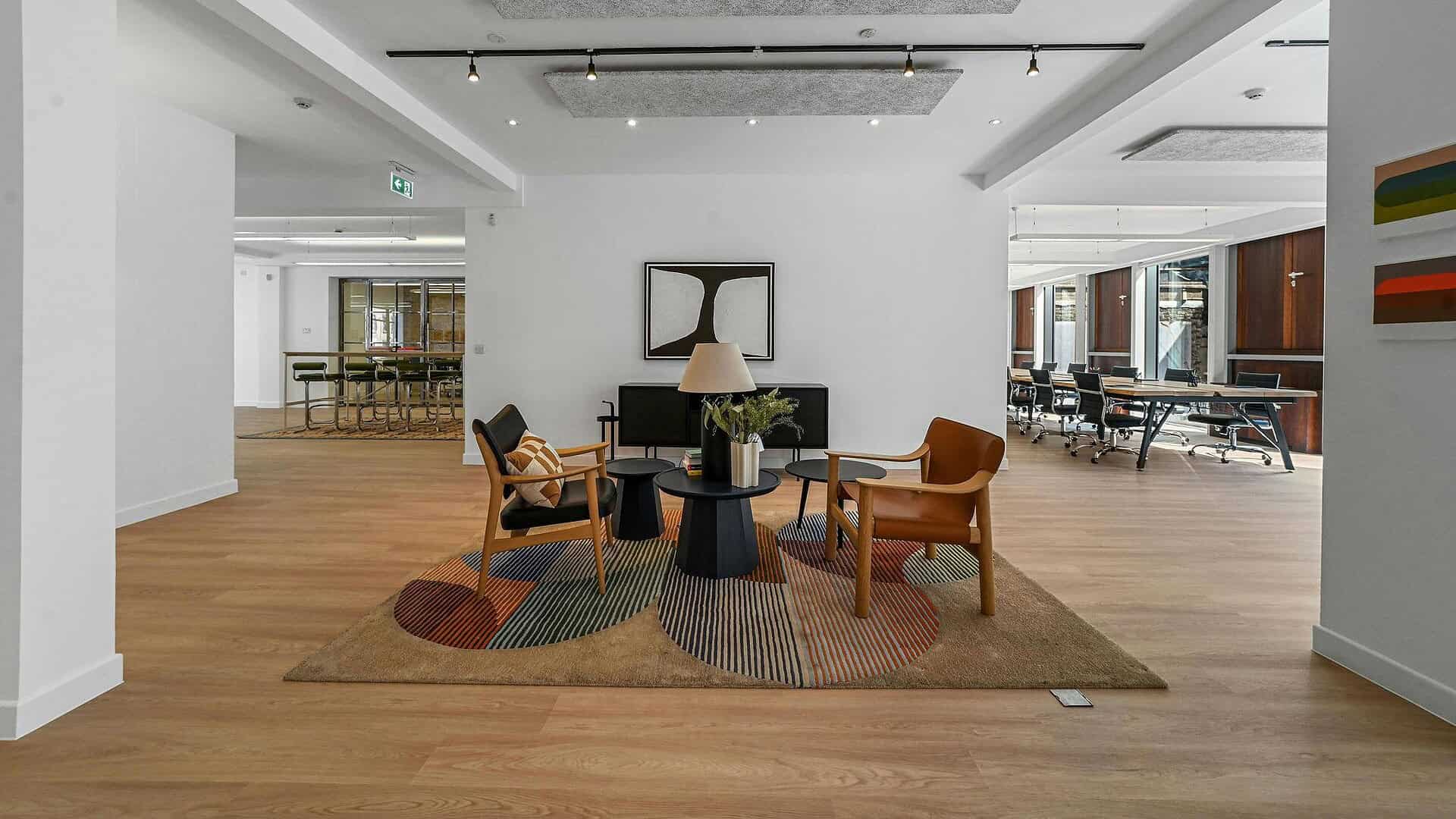 Spacious hotel lobby featuring modern furniture, stylish seating arrangements, and contemporary interior design, ideal for relaxing or waiting in a luxurious environment.