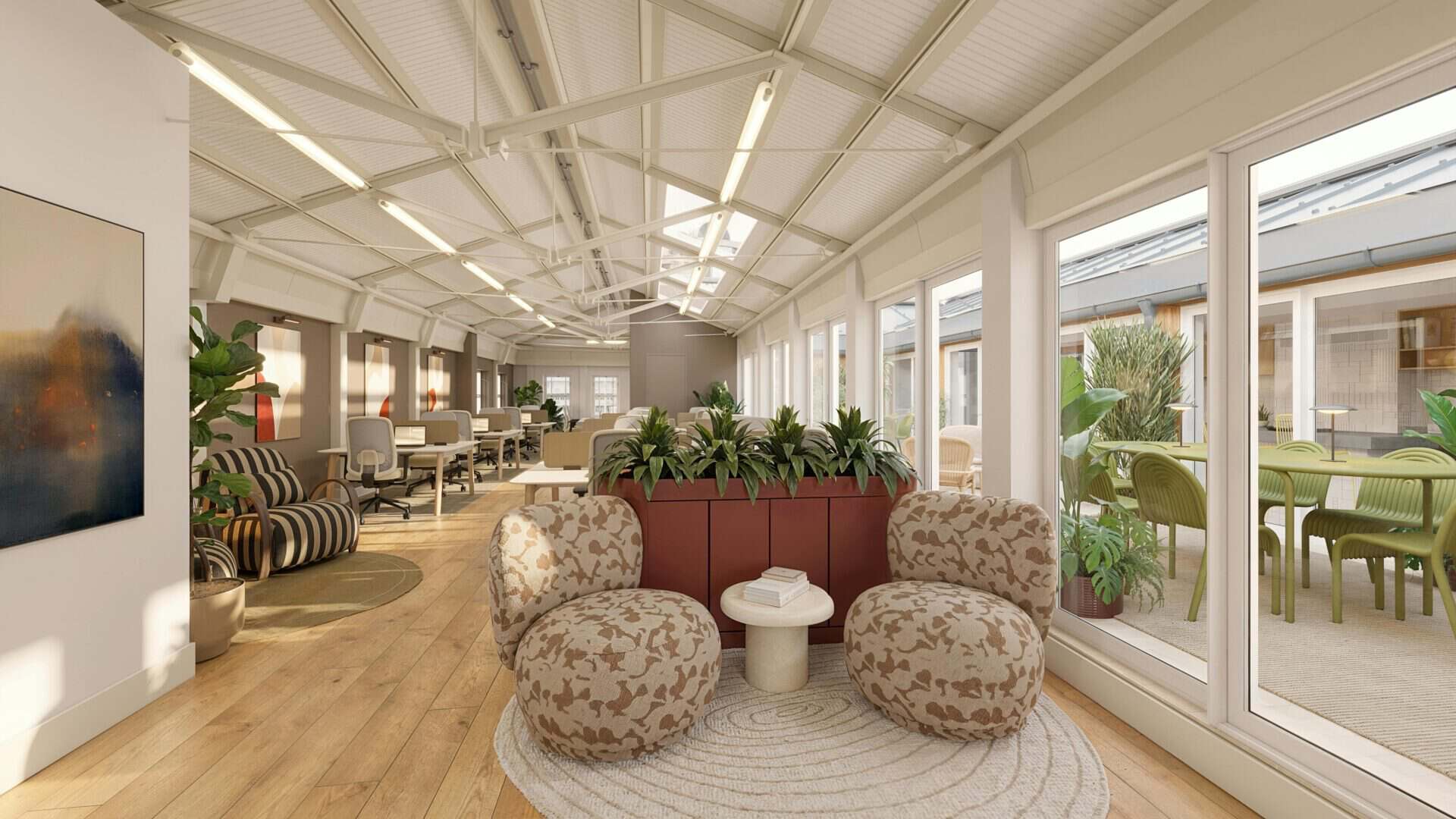Interior view of The Rooftop at Rochelle with comfortable seating, large windows, and greenery, offering a relaxing atmosphere in London.